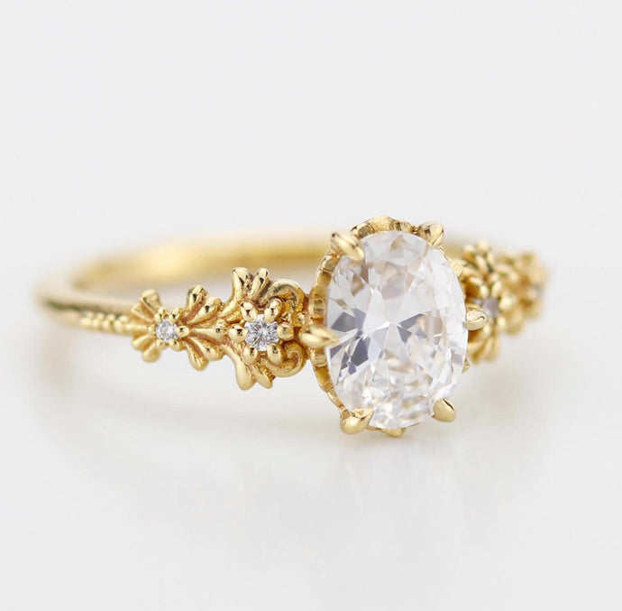 Baroque-style oval Moissanite ring with real Moissanite center stone and diamond accents on the sides, featuring elegant vintage-inspired detailing and ornate curves for a timeless and luxurious look.