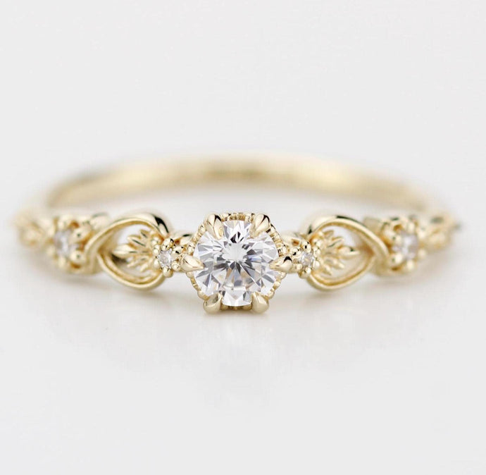 "Baroque 18k gold engagement ring featuring a 0.25 ct natural diamond with accent diamonds and vintage-inspired detailing